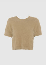 beige fluffy knit top on a light grey background