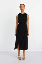 Woman wearing a black sleeveless dress on a white background