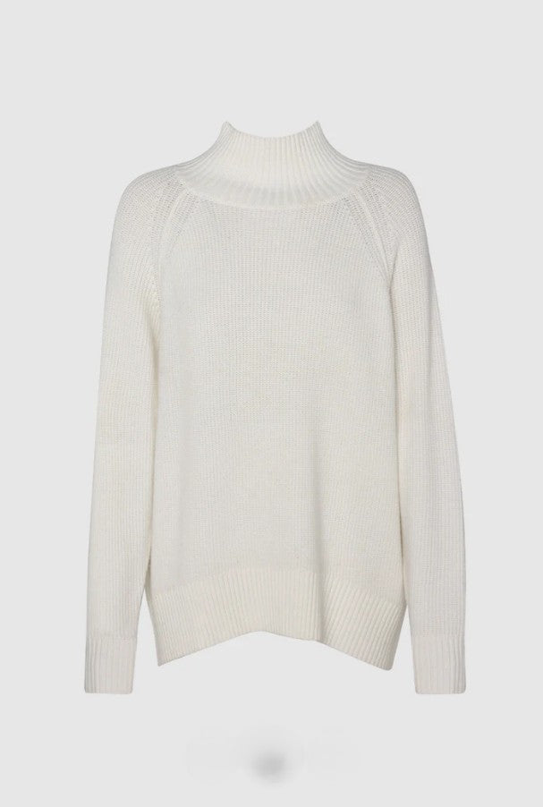White ribbed turtleneck  sweater on a light grey background