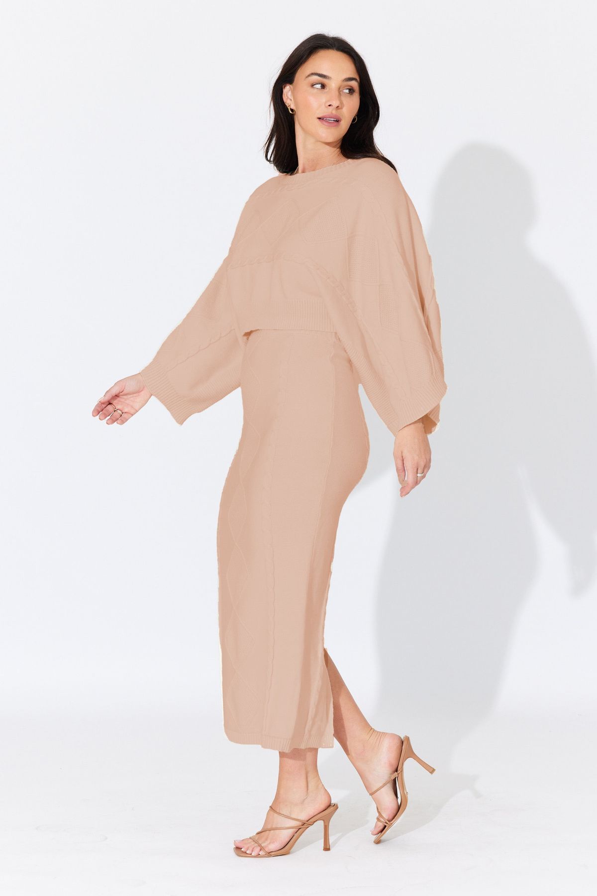 Side profile of the Aggie Knit Top in Caramel, showing ribbed texture and high neckline. Perfect for layering or styling solo on crisp winter days.