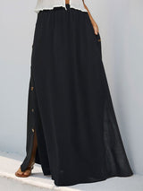 Side view of maxi skirt showing gold button detail