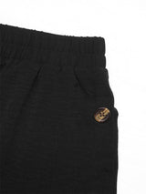 Close-up of high waist and fabric texture on black skirt