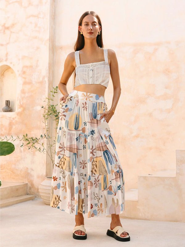 A model wearing the Asha Maxi Skirt in white with Euro-inspired print, paired with a crop top.