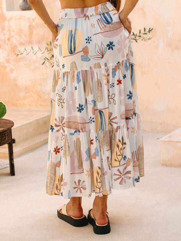 The Asha Maxi Skirt styled for a relaxed summer look with flat sandals.