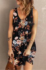 Woman wearing a black floral mini dress against a neutral background
