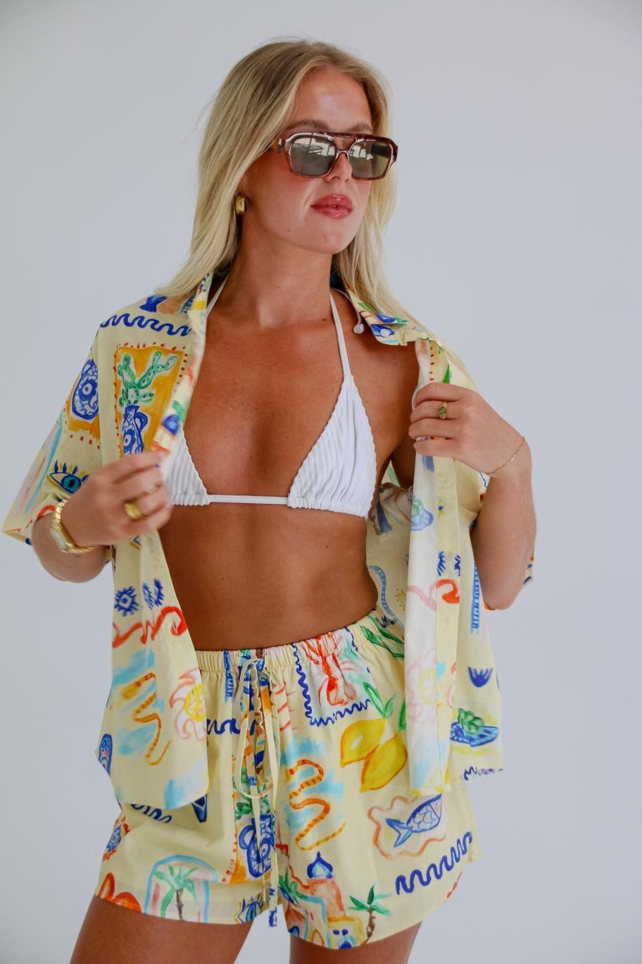 Close-up of Cairo’s exclusive hand-painted print in yellow, blue, and coral tones.