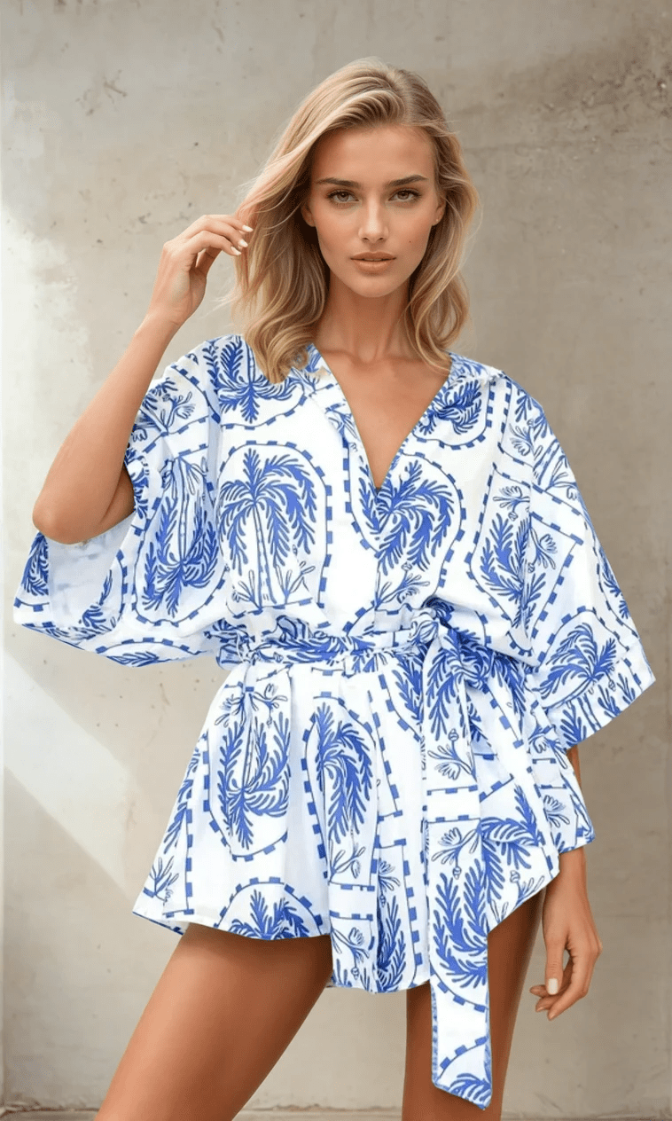  full view of the Calico Blue Playsuit showing the breezy fabric and defined waist tie.