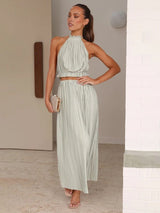 A model wearing the Calista Skirt and Top Two Piece Set in mint, styled for a chic and modern look.