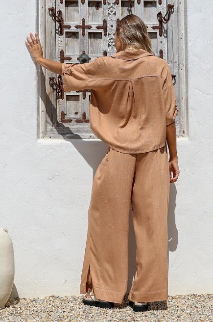 Back of the Canggu Terra Shirt & Pants showing creamy contrast stitching and relaxed cut.