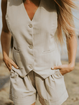 Close-up of the Carrie Vest showing front button details and soft cotton texture.