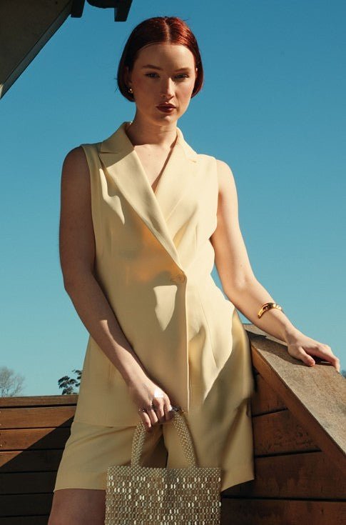 Side view of the Clara Vest and Shorts Two Piece Set showing the sleek structured fit.