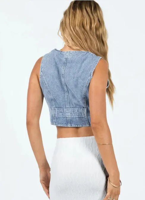 Back view of Denim Vibing Me Vest showing panel stitching and cropped hem.