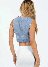 Back view of Denim Vibing Me Vest showing panel stitching and cropped hem.