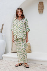 Model stands facing forward in full Echo set, smiling and showcasing the relaxed fit and boho aesthetic.