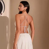 Back view of the halter tie and crossover detail on the Eden Two Piece Set