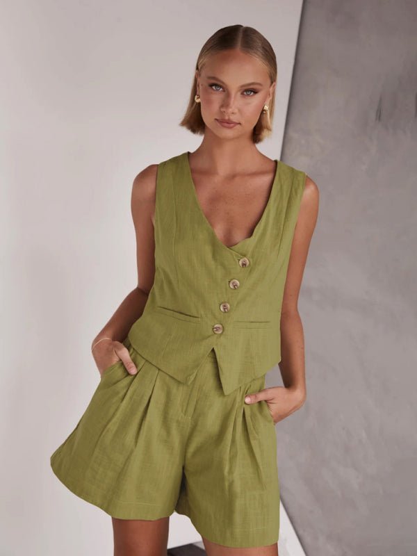 Model wearing olive Eyes On Me two piece set with V-neck vest and tailored shorts.