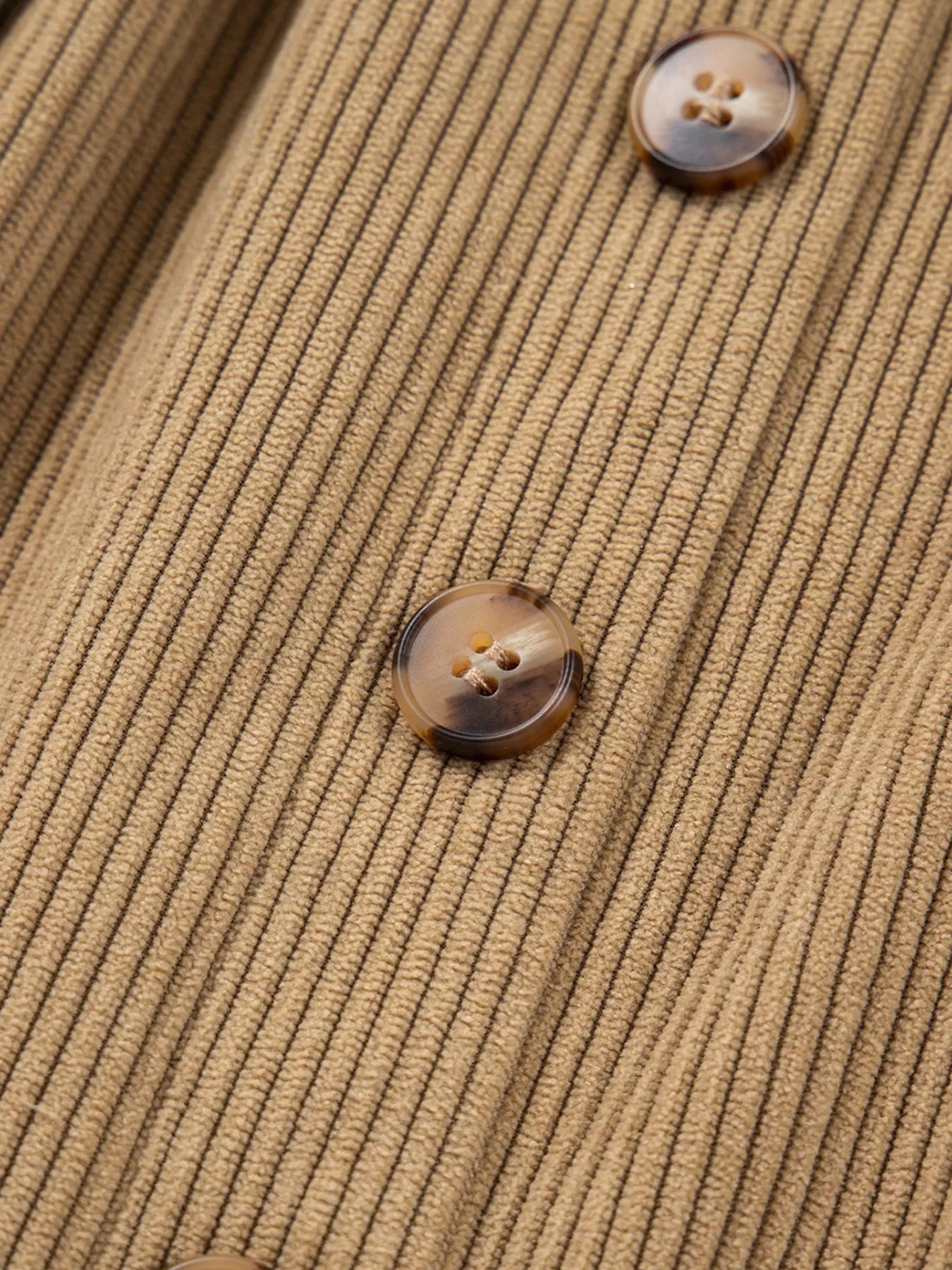 Close-up of corduroy fabric texture and seams