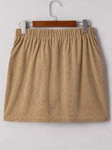 Back view of tan corduroy mini skirt with elastic waistband