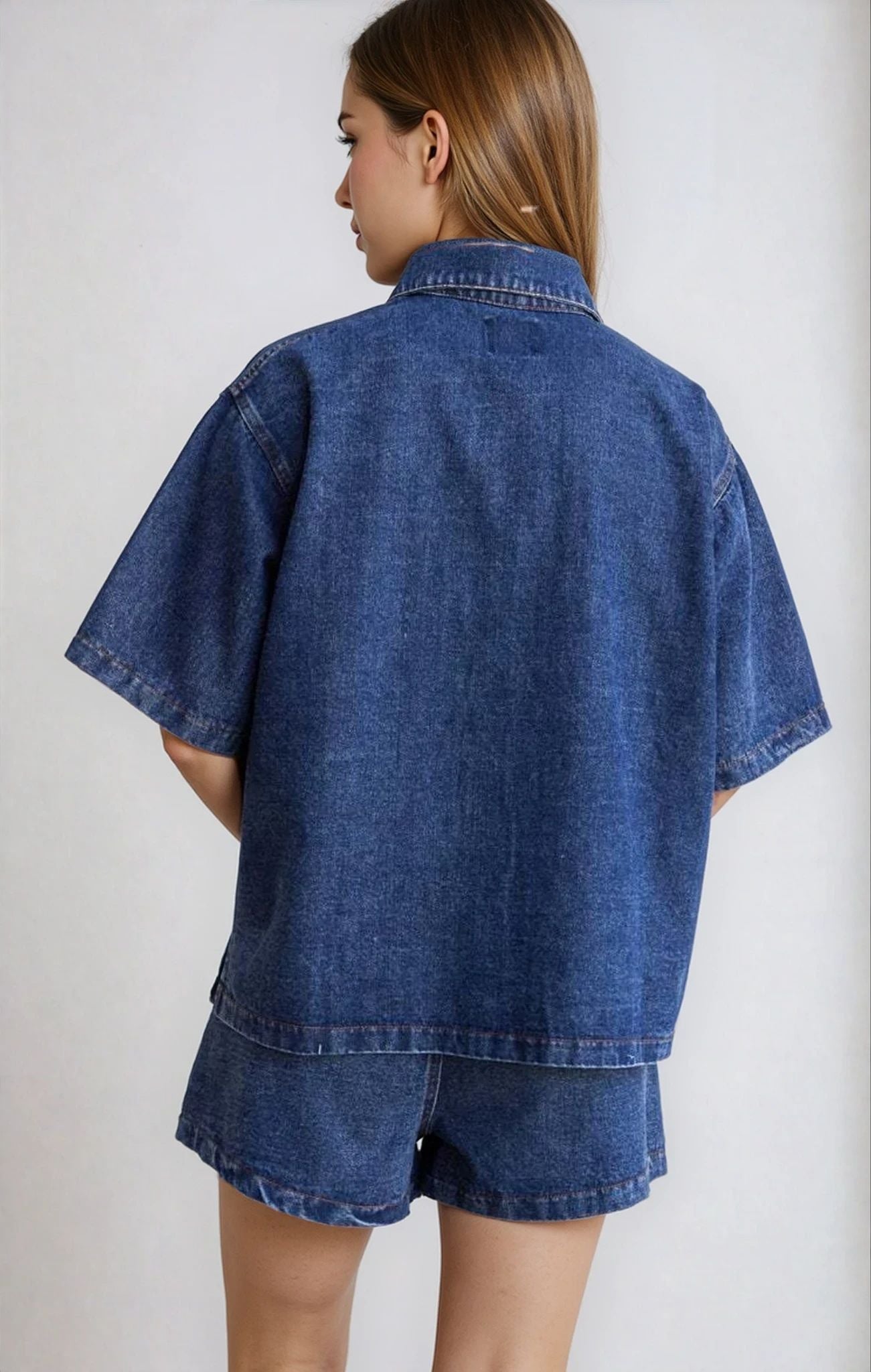 Back view of the Indigo Denim Two Piece Set, featuring a loose-fitting shirt and tailored shorts.
