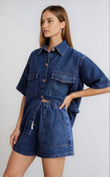 Front view of the model with one hand on waist, showing the shirt untucked and relaxed.