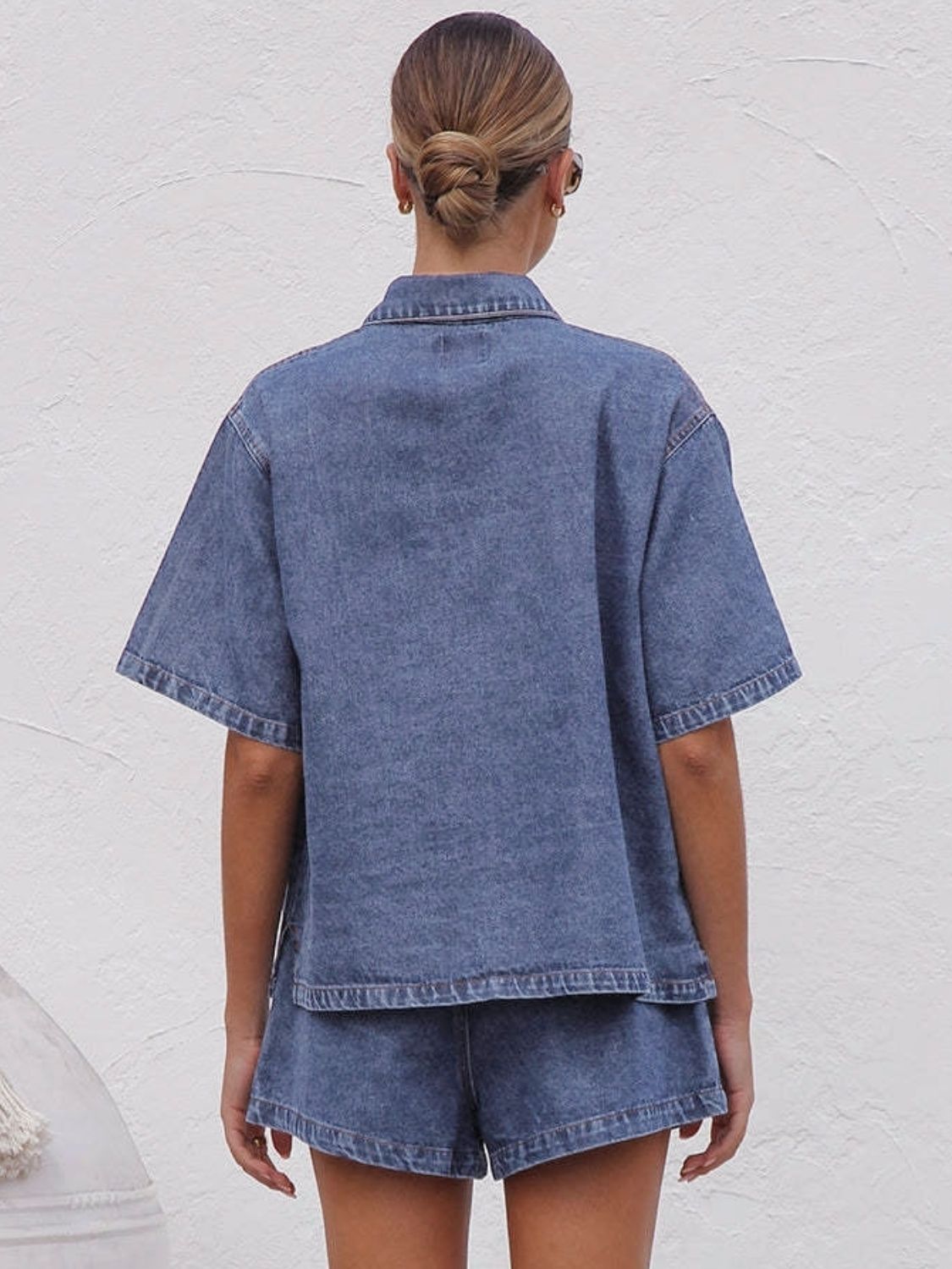 Back view of shirt showing relaxed shoulders and boxy shape.
