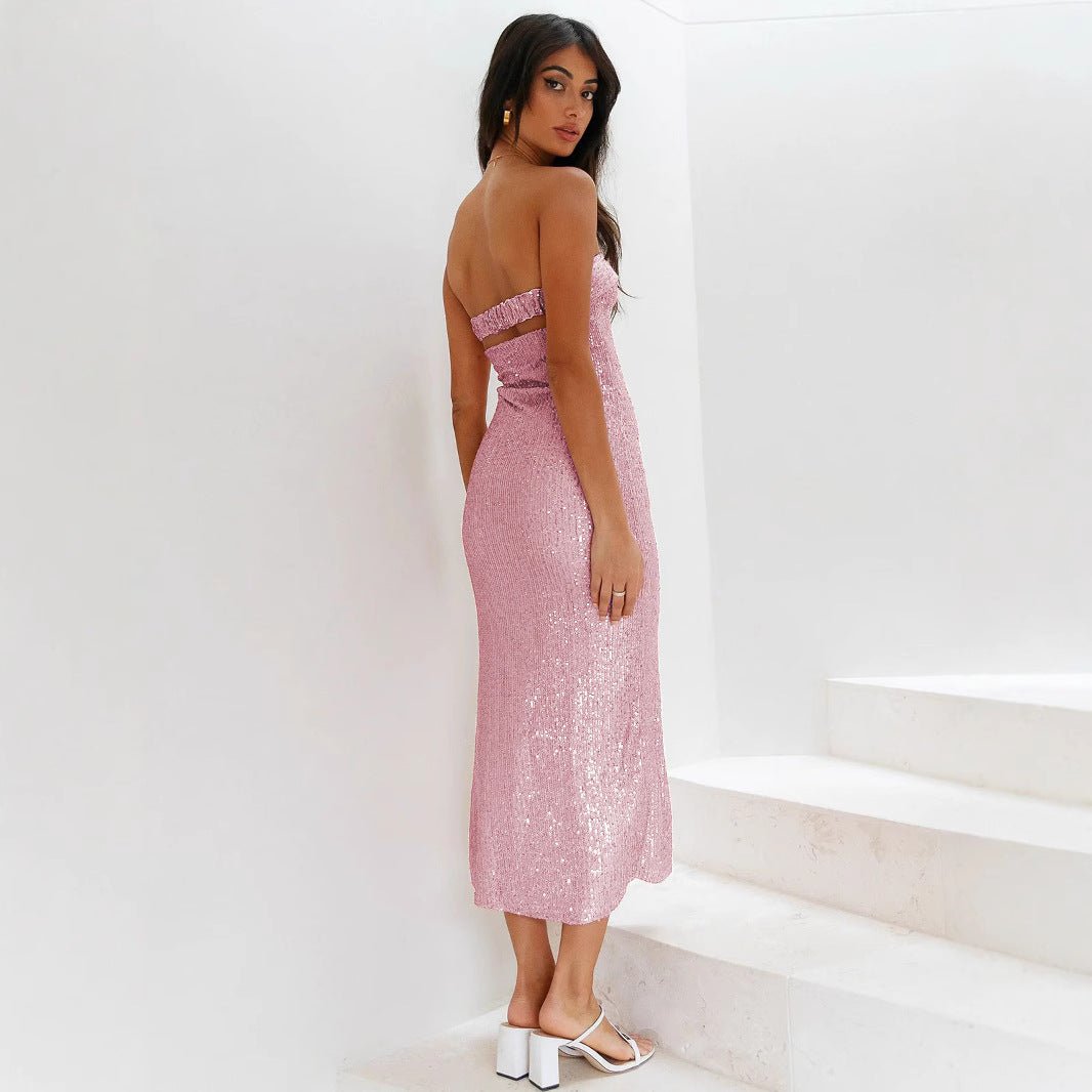 Woman wearing a pink strapless dress against a white background
