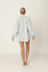 Back view of the Luna Top in Sky Blue showing the relaxed oversized fit and high-low hem.