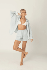 Model styling the Luna Shorts with the matching Luna Shirt for a coordinated look.