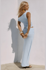 Full-body shot of Malani Set in sunlight, styled with bangles.