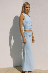 Side view of the Malani Top showing ruched detail and shoulder cut.