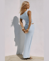 Back view of the Malani One Shoulder Top and Ruched Maxi Skirt Two Piece Set displaying the smooth, elegant silhouette.