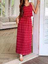 Side angle of the Marbella Skirt and Top Two Piece Set in red highlighting its flowing maxi skirt.