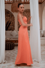 Model walking forward in the peach Marie Maxi Skirt, showcasing its flow and high waist.