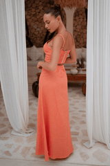 Full-length side view of the Marie Maxi Skirt in French Flax Linen, styled with heels.