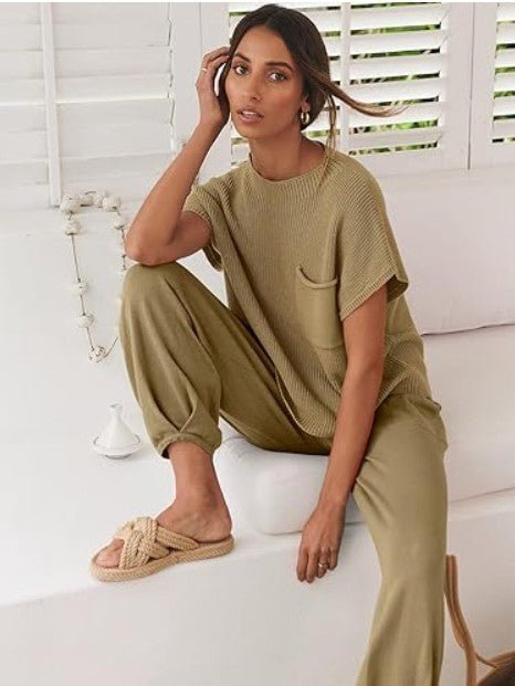 Model seated on sofa in The Marla Set, showing off comfort and drape of the soft fabric.