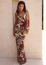 Front view of model in flowy maxi skirt and matching vest set.