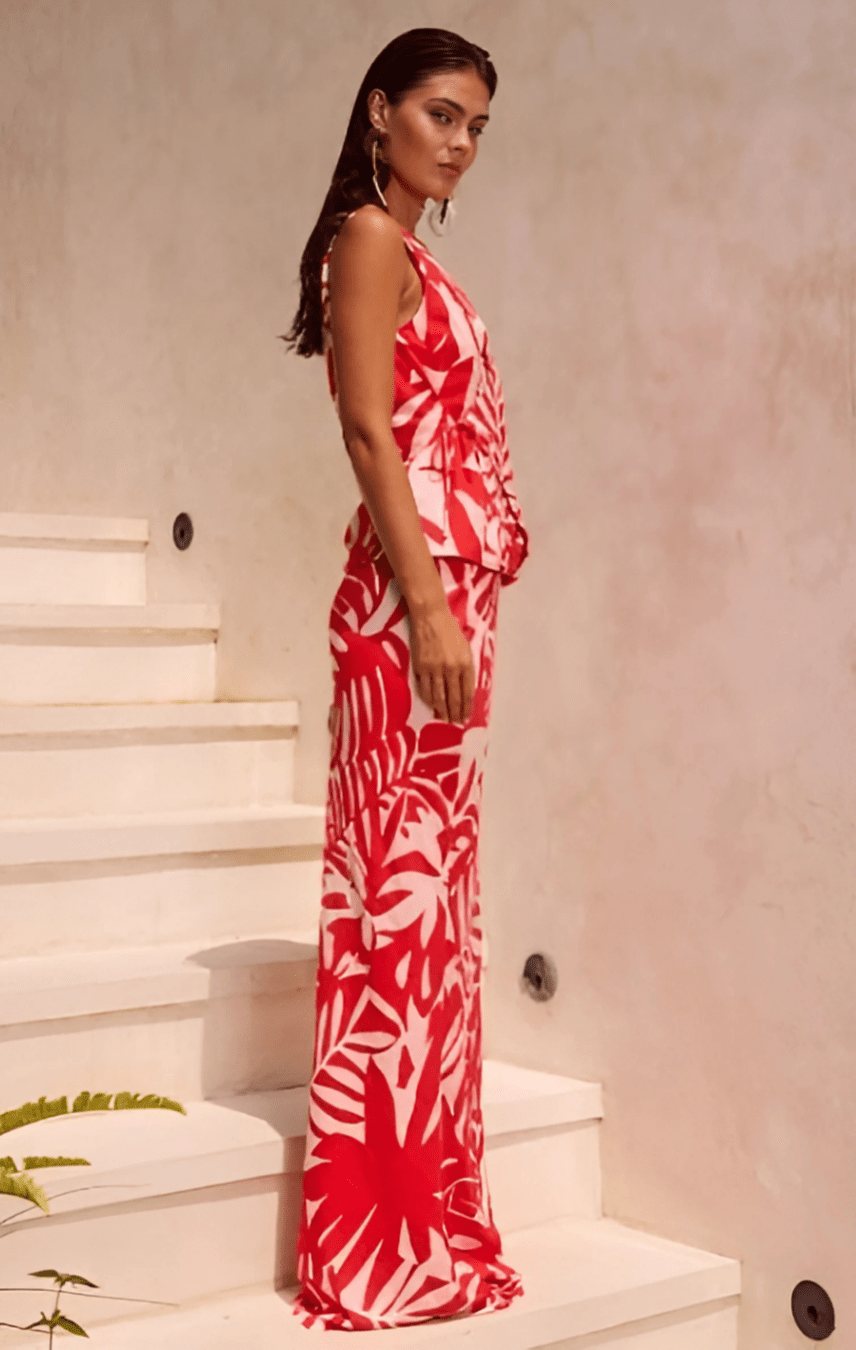 Side profile of red printed maxi skirt showing flattering fit and flow.