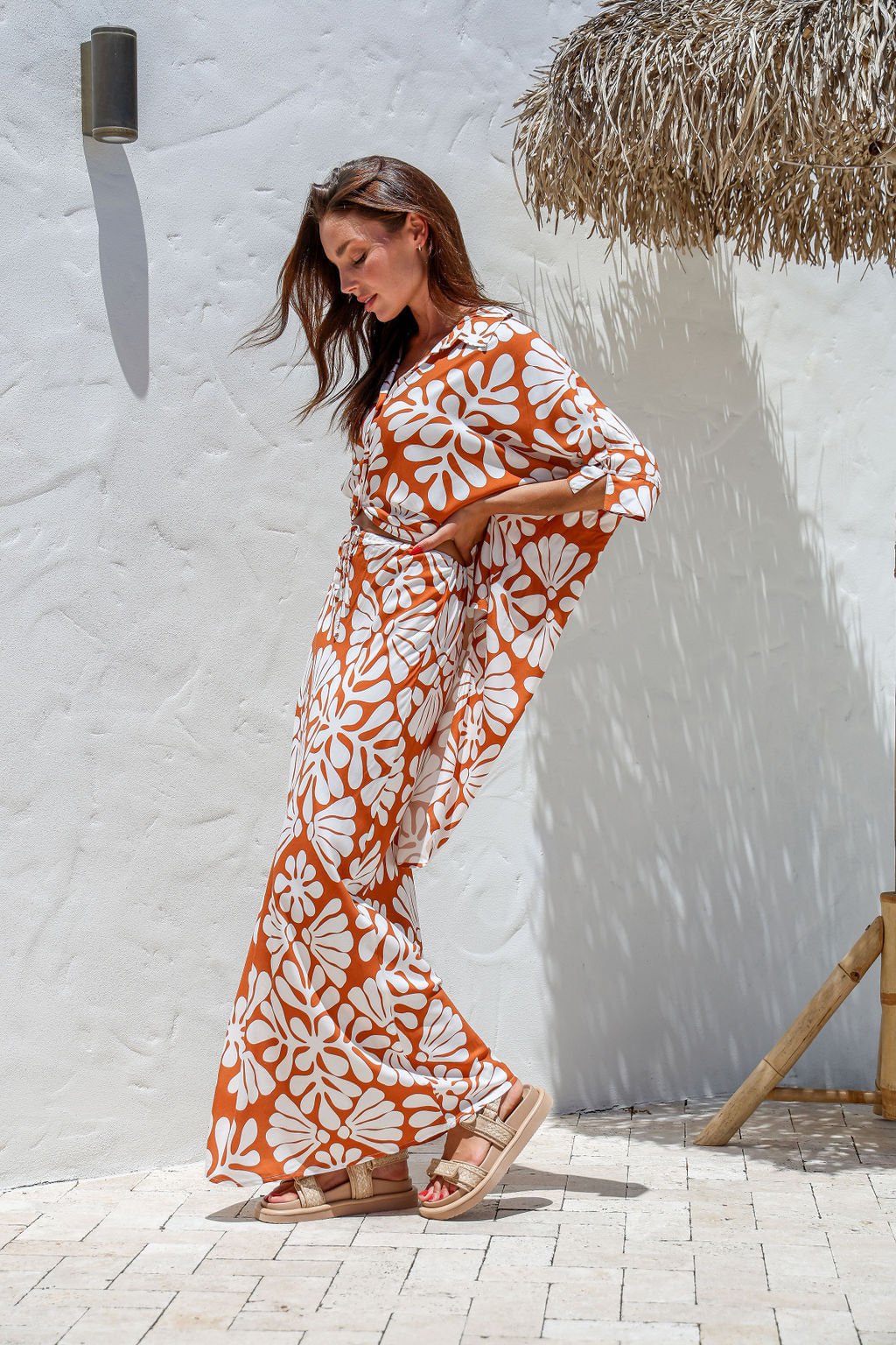 Walking shot of the Nahla set, with skirt swaying gently for an elegant, beach-ready look.