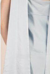 Light blue sleeveless dress with a fitted bodice and flared skirt.