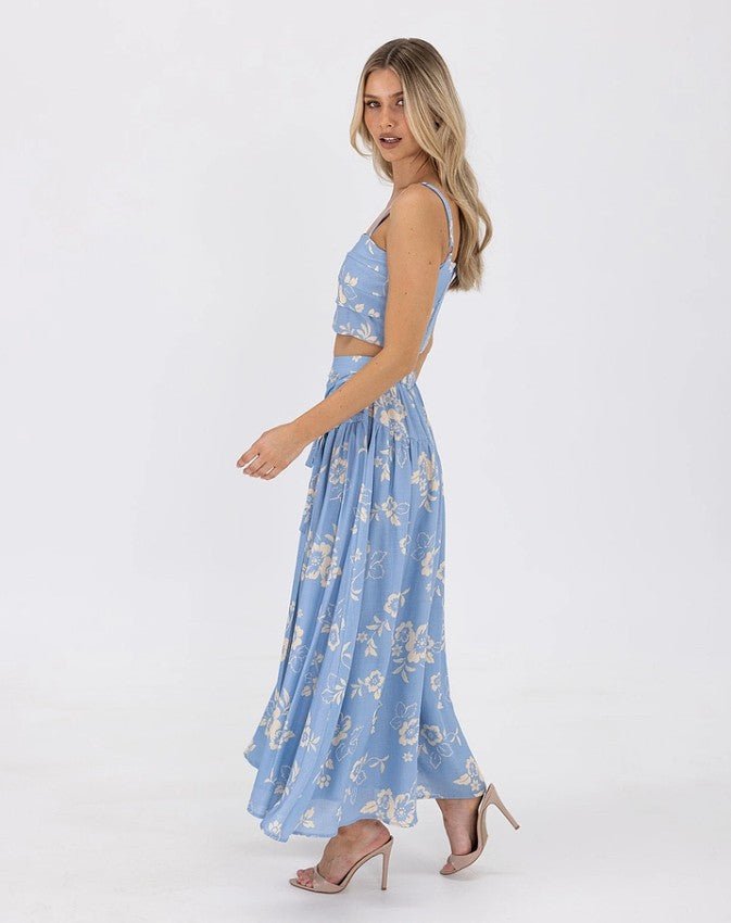 Side view of the Ralene Set, highlighting adjustable straps and skirt flow.