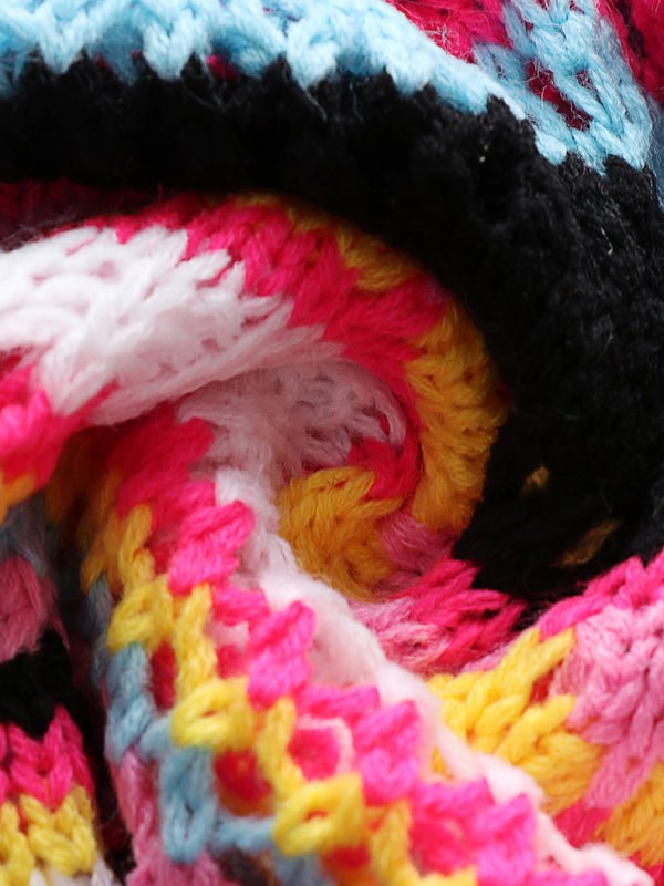Close-up of knit fabric in Pink Blush Print with rich colours and pattern.