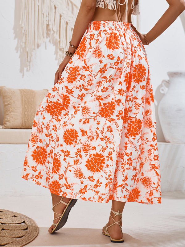 Back view of orange Summer Love Skirt showcasing its vibrant floral design and breezy silhouette.