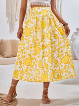 Close up view of yellow Summer Love Skirt showing flowy fabric and relaxed fit. 