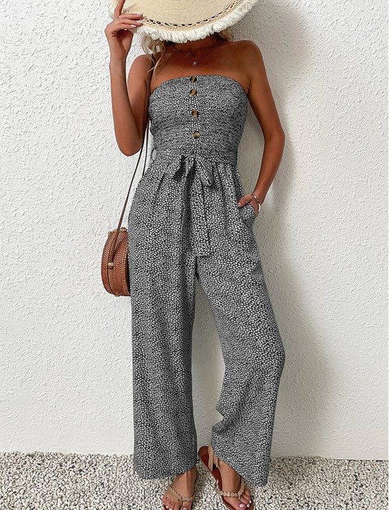 Front view of The Janisa Jumpsuit in black, showing the strapless cut and subtle waistline detailing.