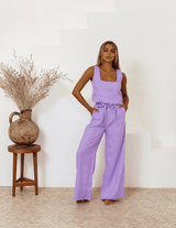 Model walking in lavender Shanti set, barefoot and relaxed