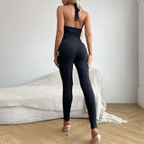 Back view of the Shona Jumpsuit in black showing slim fit and adjustable straps.
