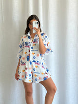 Side view of Frankie printed playsuit showing relaxed fit and bold colourful print.