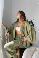Side angle of the Zafira Pants and Cardigan Two Piece Set in olive showing the cardigan’s open front design.