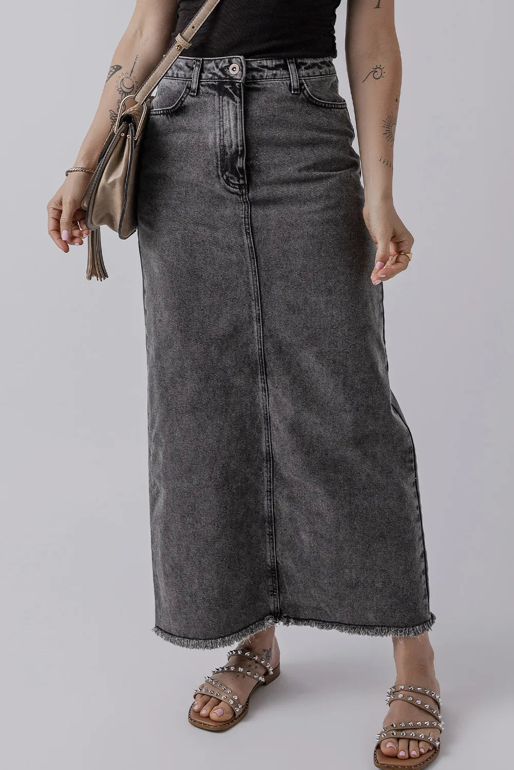 Side angle of the Zuri Maxi Denim Skirt in Black showing the clean straight fit.