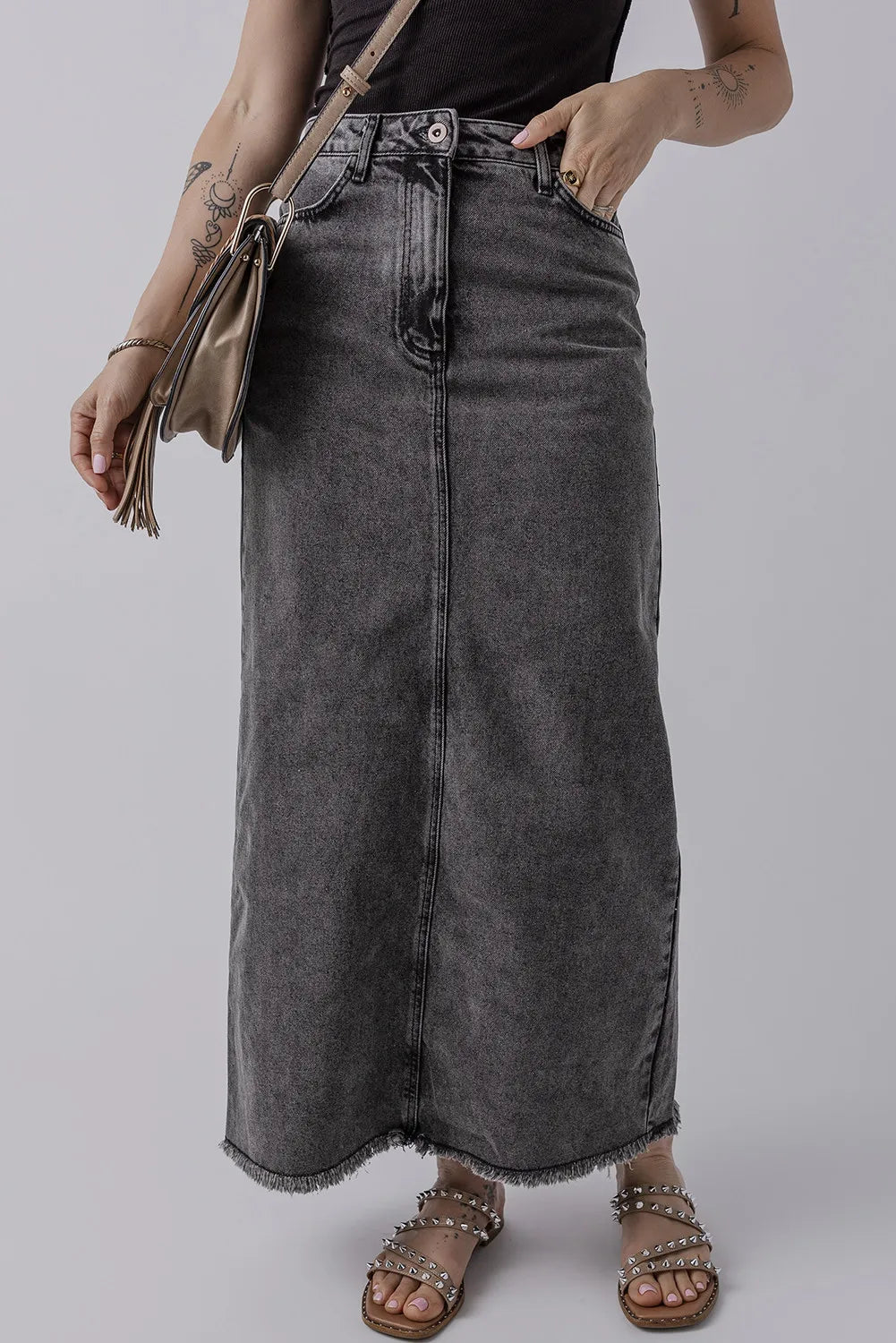 Front view of the Zuri Maxi Denim Skirt in Black styled with a black tank and sandals.